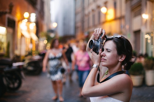 A girl with Camera on shooting Photography
