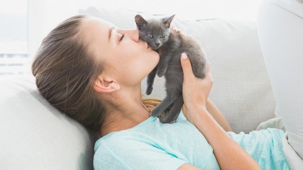 lady kissing pet